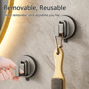 Strong vacuum suction cup hook in matte dark gray on smooth tile bathroom wall