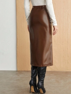 Detail of high waisted dark brown PU leather midi skirt with slim fit back view