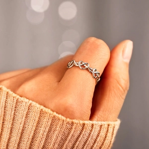Minimalist S925 sterling silver ring with heart link design worn on female hand