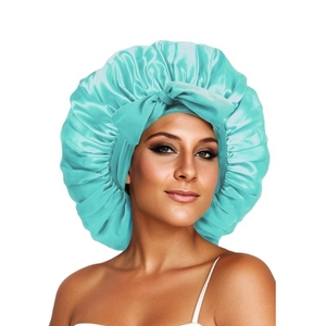 Close-up of light blue satin sleep cap featuring a large decorative bow for hair care
