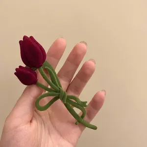 Elegant wine red flocked tulip hair clip with green bow design for women's hairstyles