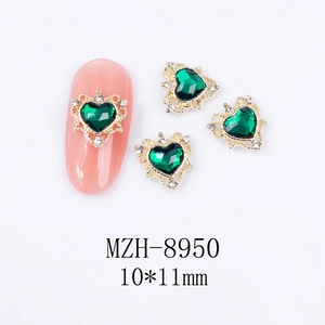 Detail of emerald heart nail charms with golden crown base and size info 10x11mm