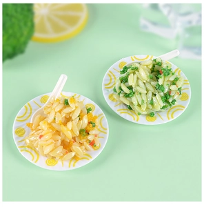 Detailed view of miniature fried rice models on white plates with tiny spoons