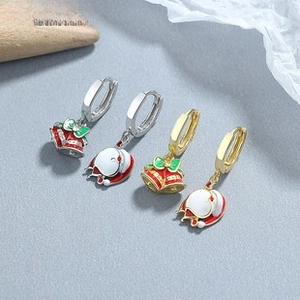 Detail view of S925 silver Christmas earrings with enamel bell and Santa hat design