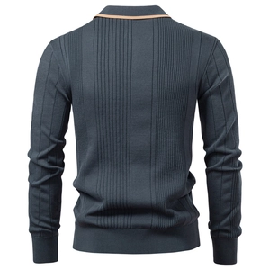 Detail of dark blue ribbed knit polo sweater with tan collar trim and textured fabric