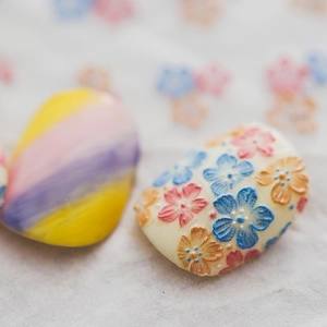 Adhesive nail art stickers featuring gradient colors and 3D floral embossed textures