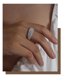 Close-up of a wide silver titanium steel ring pavé-set with sparkling Czech crystals