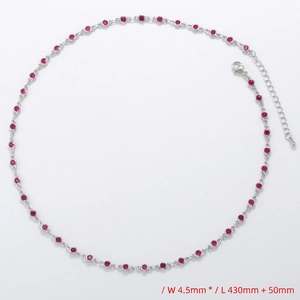 Detail of silver necklace featuring 4.5mm round red gemstones with adjustable 43cm chain