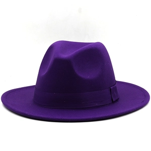 Close-up of a purple felt fedora hat featuring a matching grosgrain ribbon and crown dent