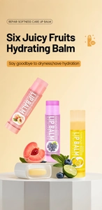 Detailed view of nectarine, grape and lemon lip balms with fresh fruit on white podium