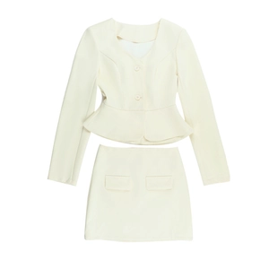 Detail of cream long sleeve V-neck top with peplum hem and matching mini skirt set