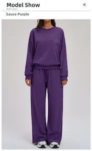 Detail of dark purple sweatshirt set featuring a round neck top and wide leg pants