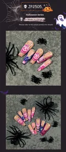 Detailed view of Halloween press-on nails with purple pumpkin, ghost, and rhinestone accents
