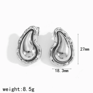 Detail of silver lava teardrop earrings with dimensions 27mm height and 18.3mm width