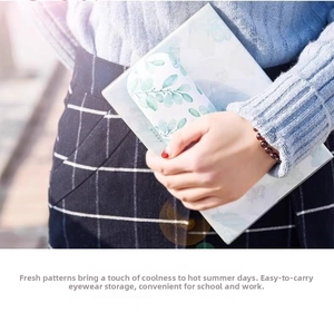 Detail showing portable fresh leaf print eyeglass case with durable hard shell material
