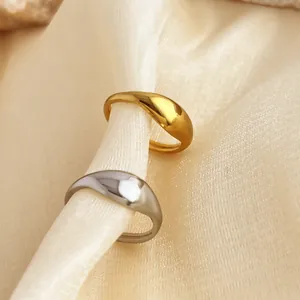 Minimalist polished stainless steel fluid teardrop rings in gold and silver finish