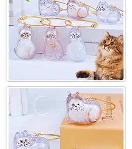 Detailed view of cat-shaped hair collection capsule with a gold wire keychain loop