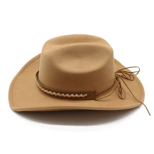 Detail of camel wool felt cowboy hat featuring a brown leather band and wide curved brim