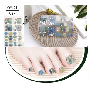 Detail of QYJ21 027 toenail stickers with green blue marble and gold glitter rhinestones