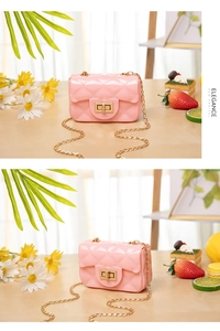 Detail of pink quilted jelly bag featuring gold twist lock and elegant chain strap