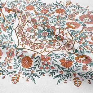 Detailed texture of bohemian tapestry featuring orange and teal floral patterns