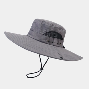 Detail of outdoor sun hat with breathable black mesh vents and adjustable wind cord