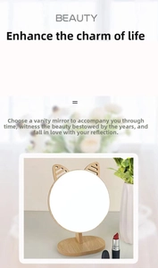 Close-up of circular makeup mirror with wooden cat ear decor and solid wood stand