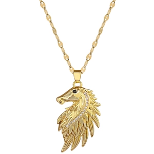 Luxury horse and feather pendant necklace with crystals in gold finish on white background