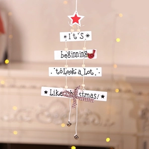 Christmas tree shaped wooden hanging sign with white slats and festive greeting text