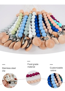 Detail showing stainless steel clip and food grade silicone beads for pacifier chain