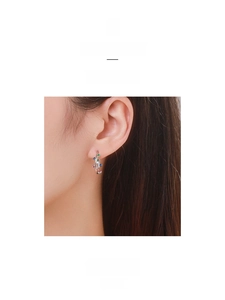 Detailed close-up of S925 sterling silver ear cuff with colorful cubic zirconia stones