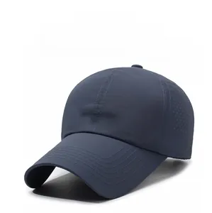 Detail of laser-cut ventilation holes and embroidered NARAS logo on navy baseball cap