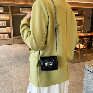 Elegant black quilted leather shoulder bag with gold chain strap for stylish women