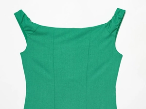 Close-up of green linen blend sleeveless top featuring a square neck and pleated shoulder straps