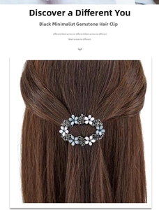 Detailed view of oval floral hair clip with blue resin petals on brown hair
