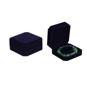Octagonal navy velvet bracelet box shown in open and closed views with plush texture