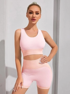 Pink honeycomb texture seamless yoga set with high waist shorts and sports bra for fitness