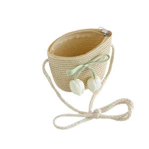Kids woven straw shoulder bag with green ribbon bow and white tulip charms