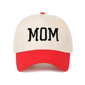 Close-up of MOM embroidery and red brim details on a vintage trucker baseball cap
