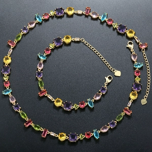 Macro shot of colorful zircon stones set in golden links for jewelry set