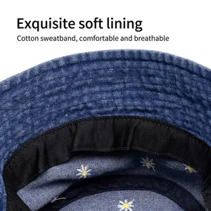 Deep blue denim bucket hat with daisy embroidery and a comfortable cotton sweatband detail