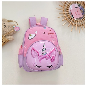 Detail of unicorn school backpack for kids with Dream Bigger text and shiny PU pocket