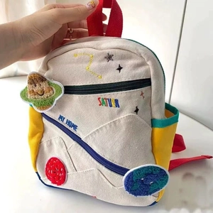 Cute canvas kids backpack with universe embroidery and red handles for kindergarten
