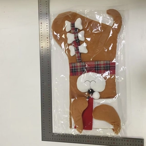 Detailed close-up of a 50cm dog-shaped plush Christmas stocking with a bone charm