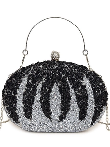 Elegant pumpkin-shaped evening bag with silver stripes and rhinestone clasp