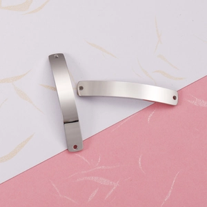 Macro detail of curved stainless steel rectangle connector for DIY jewelry crafting