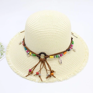 Bohemian wide brim straw hat with shells, colorful beads and tassels for beach vacations