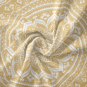 Close-up of mustard yellow mandala tapestry fabric showing texture and soft material
