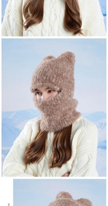 Close-up of brown plush balaclava hood with animal ears and soft faux fur texture