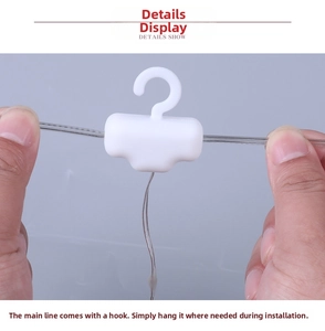 Detail showing the white plastic hooks on the Christmas LED string lights for easy hanging